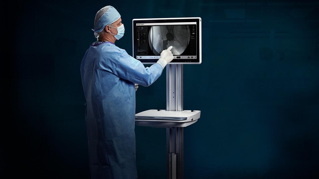 Surgeon views One Trial image on monitor Module One