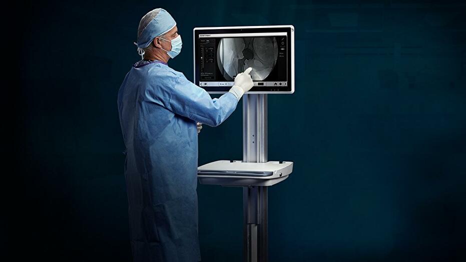 Surgeon views One Trial image on monitor Module One